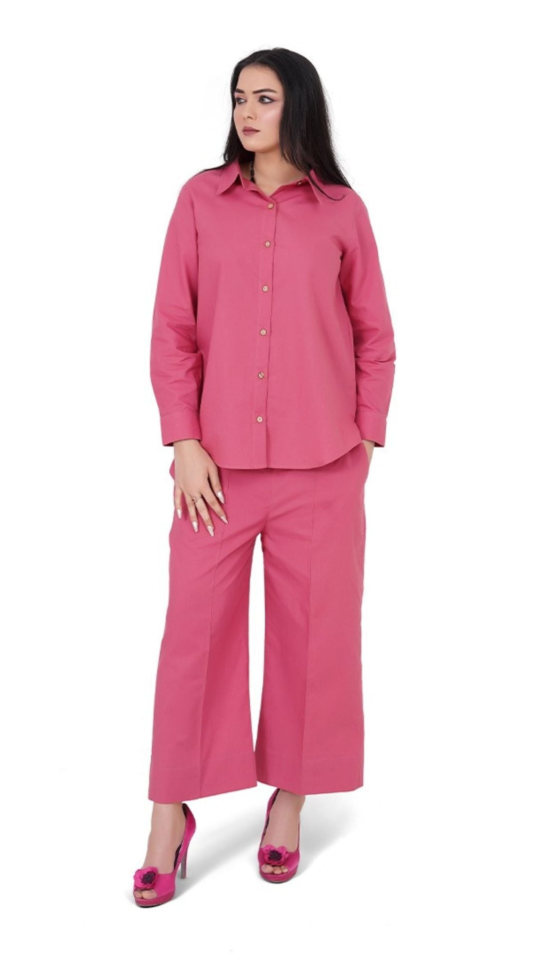 Woman wearing a pink outfit on a white background