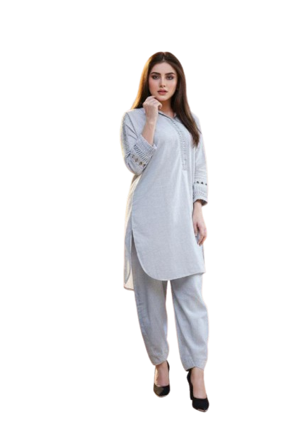 Woman wearing a light gray kurta with pants on a white background