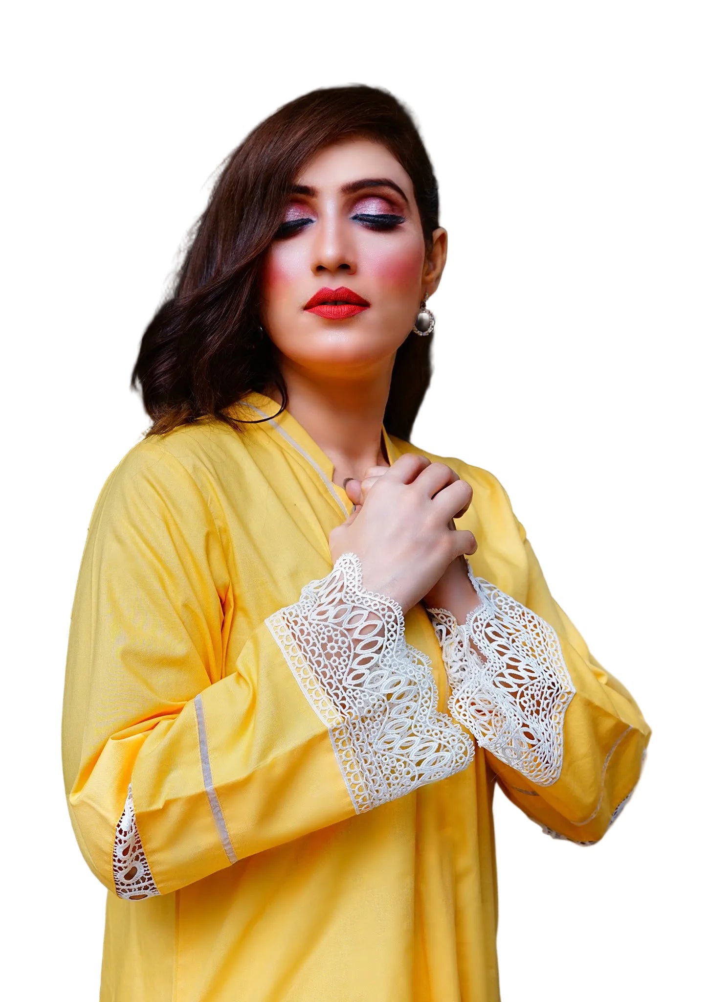 Woman wearing a yellow outfit with lace details indoors.