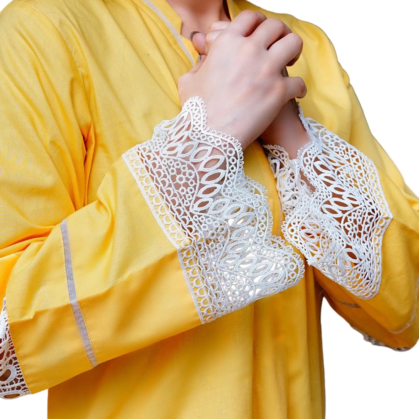 Yellow garment with white lace cuffs and hem